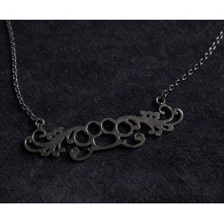 Collier poing américain "arabesque"